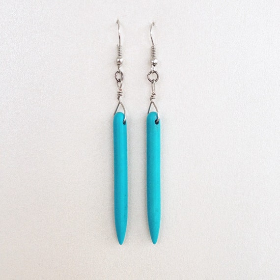 Items similar to Turquoise blue howlite spike earrings on Etsy