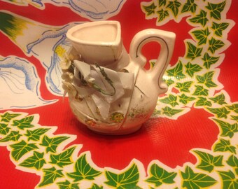 Vintage miniature ceramic pink pitcher with gold accents and floral designs