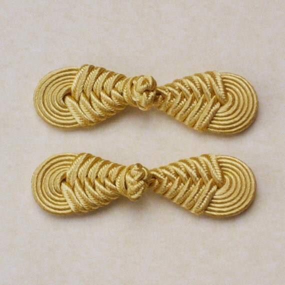 Pale gold frog closure. Round knot. Set of 2