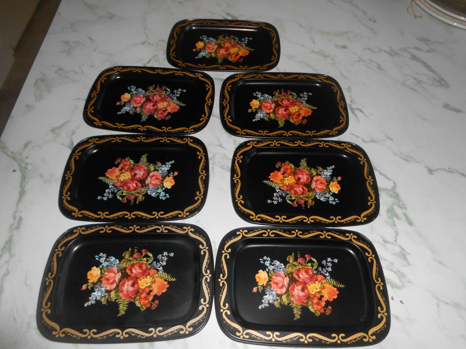 Vintage 50’s mini metal snack trays, used for nuts and candies or as coasters, black background