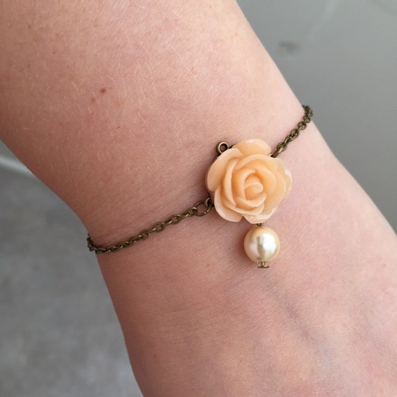 Items similar to SALE! Pretty bracelet with peach flower and ivory