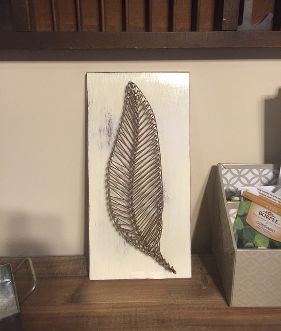 Feather or Leaf nail and string art on wood.