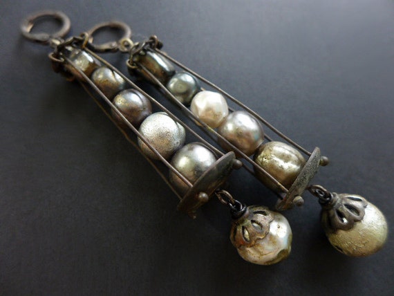 Silver Moons. Caged baroque pearl earrings.