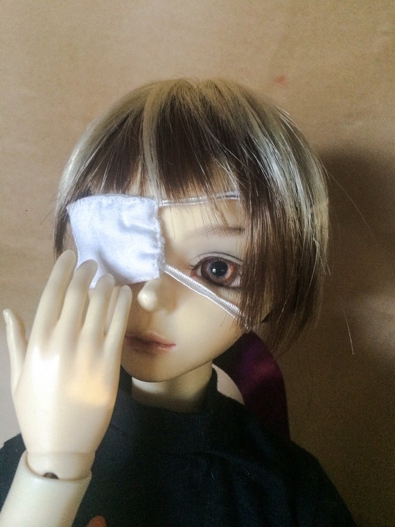 White medical doll eye patch