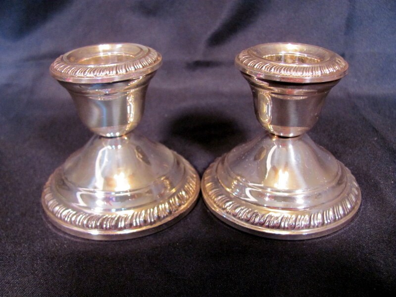 Crown sterling silver weighted candle holders.