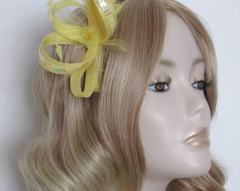 YELLOW and LEMON FASCINATOR, Made with sinamay, hackle and coque feathers,iridescent sequins, flower, on a 4in comb
