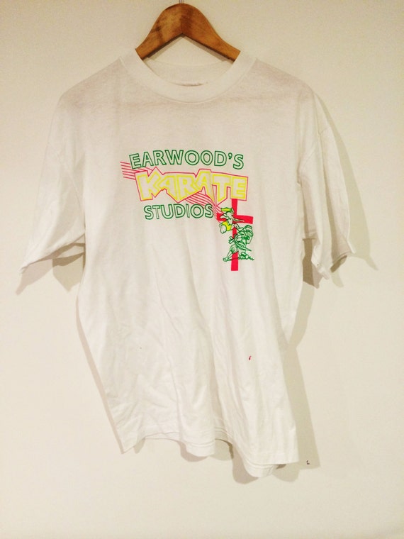 Vintage oversized white and fluro 80's t-shirt by PLANETCARAVAN01