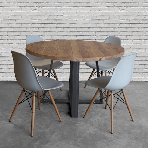 Round wood table in reclaimed wood and steel legs in your
