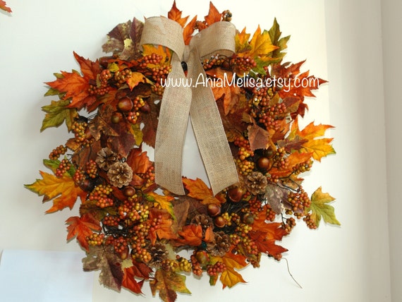 Hanging decorative wreath of warm autumnal foliage - fall door decor