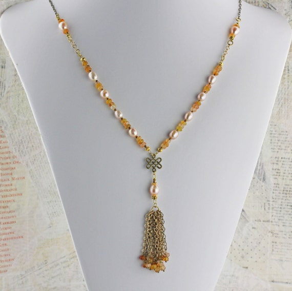 Long tassel necklace with pearls and butterscotch hessonite