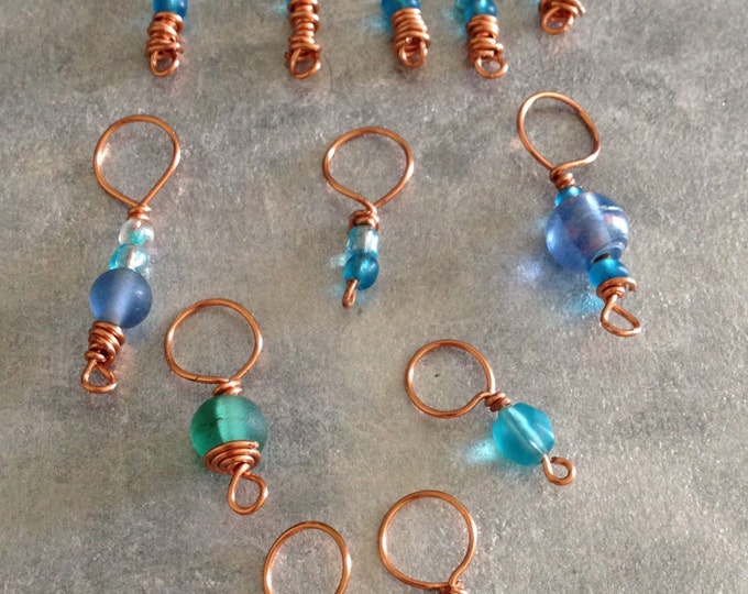 copper, blue and green stitch markers