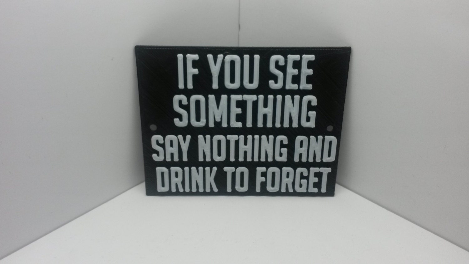 Say something words. Say nothing and Drink to forget. If you see something say nothing and Drink to forget. Say nothing. See something say something.