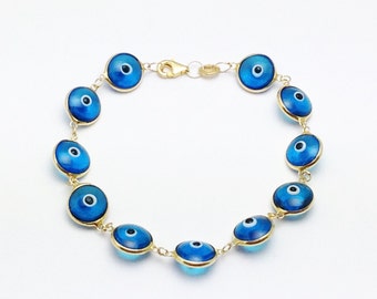 Items similar to Evil Eye with pretty bright blue glass beads on Etsy