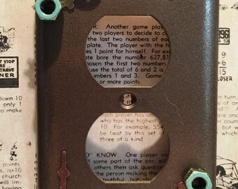 Bronze Steampunk outlet cover is individually handcrafted and unique in its own way. Made from assorted recycled materials. No two are alike