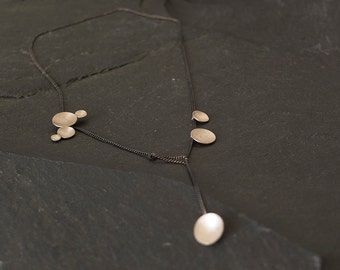 Silver circles necklace short_different circle sizes combined_dynamic and elegant
