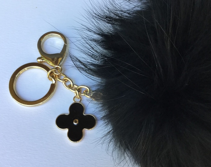 Fur pom pom keychain, bag pendant with flower charm in black