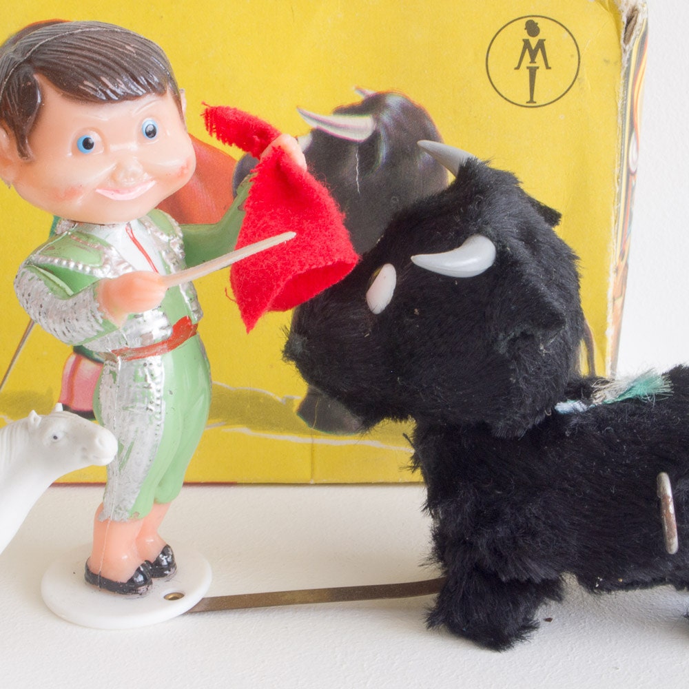 Vintage mechanical bull fighter toy