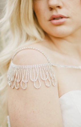 The Lux Rhinestone Shoulder Piece created with scalloped fringe detail