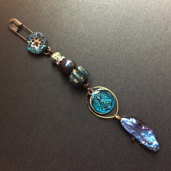 Deep Heart's Core.  Long dangle brooch in iridescent blue.