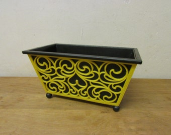 1960s/70s yellow scroll & heart plastic planter with contrast black liner and ball feet