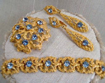 Molten metal and blue rhinestone parure, vintage gold tone lava metal bracelet brooch and earrings