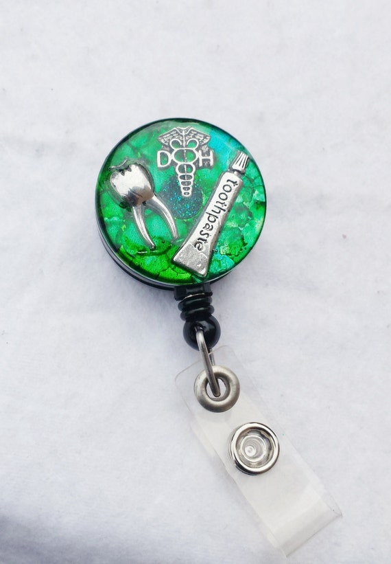 Dental hygienist retractable name badge holder with toothpaste