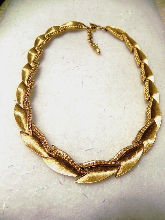 Monet vintage necklace with gold tone interlocking stylized