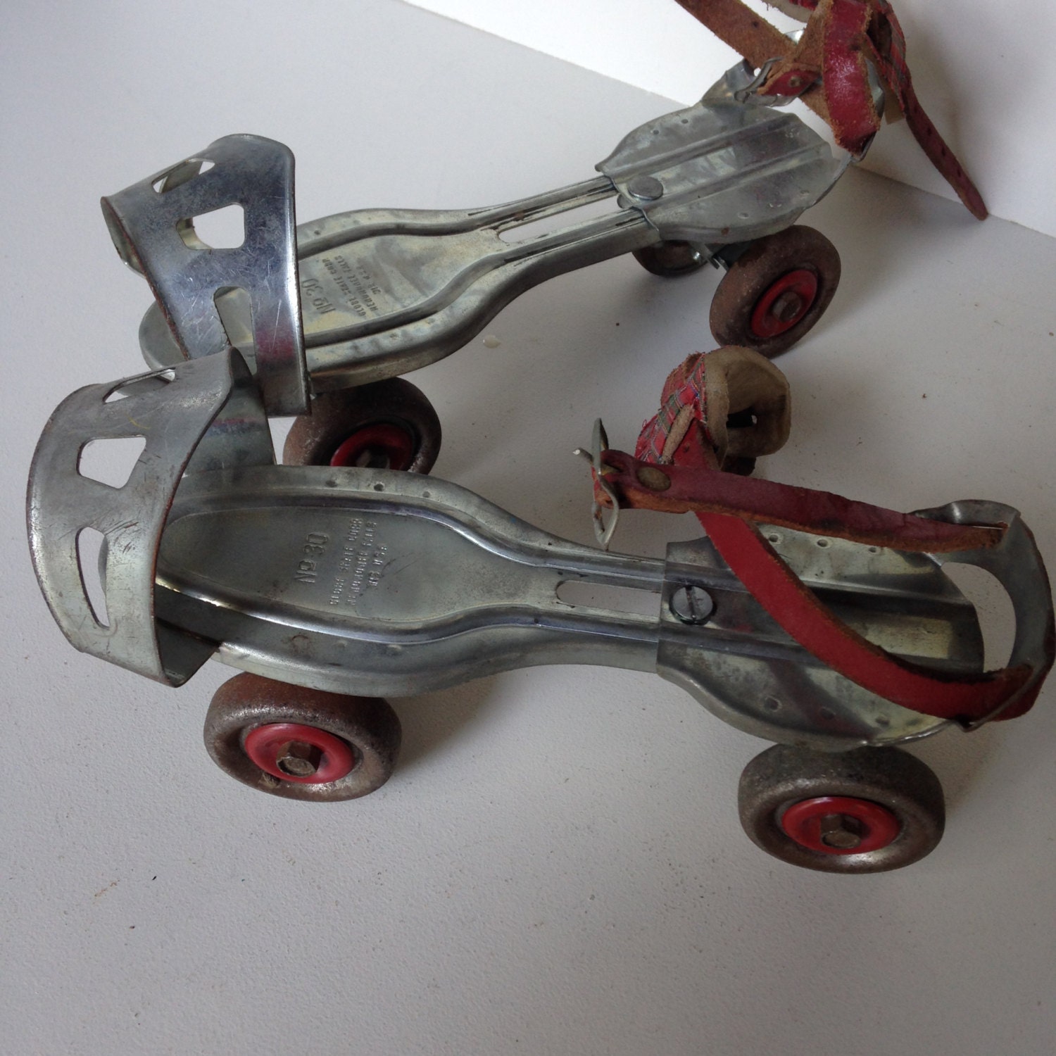 Vintage metal roller skates sidewalk 1950s 60s red wheels from