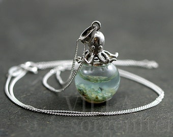 Sterling octopus seawater necklace. 925 sterling octopus carrying glass orb filled with seawater and tiny pebbles. Sterling necklace.