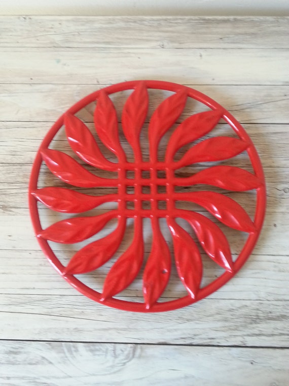 Red cast iron French trivet