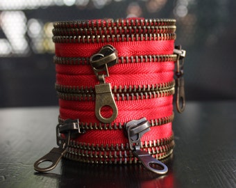 rode rits armband