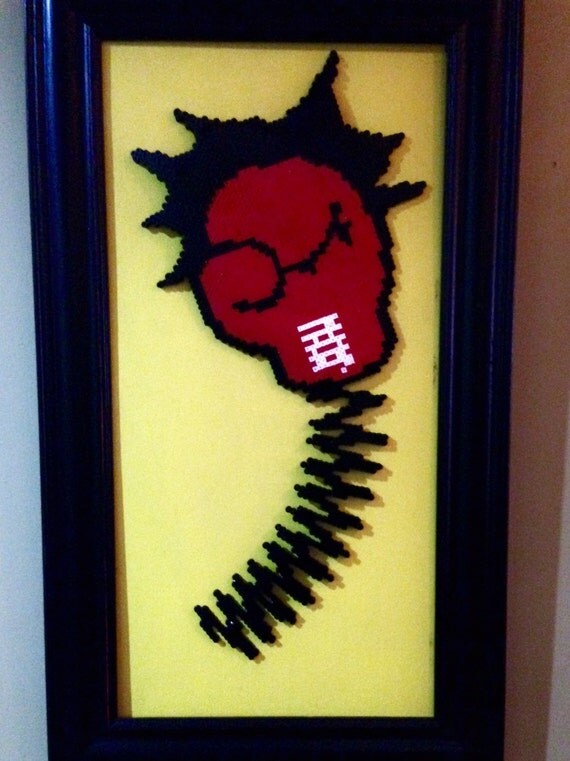 Perler bead boxing glove finished and framed by DearGawd on Etsy