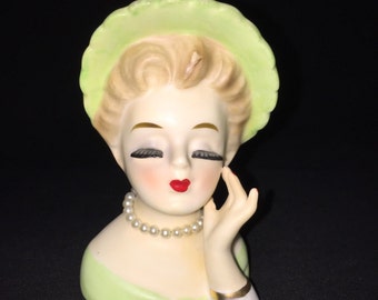 1963 Inarco head vase #E-1277. Lady with hand to face, wearing green hat & pearl necklace. 3.5" tall. Vintage. Cleve, Ohio.