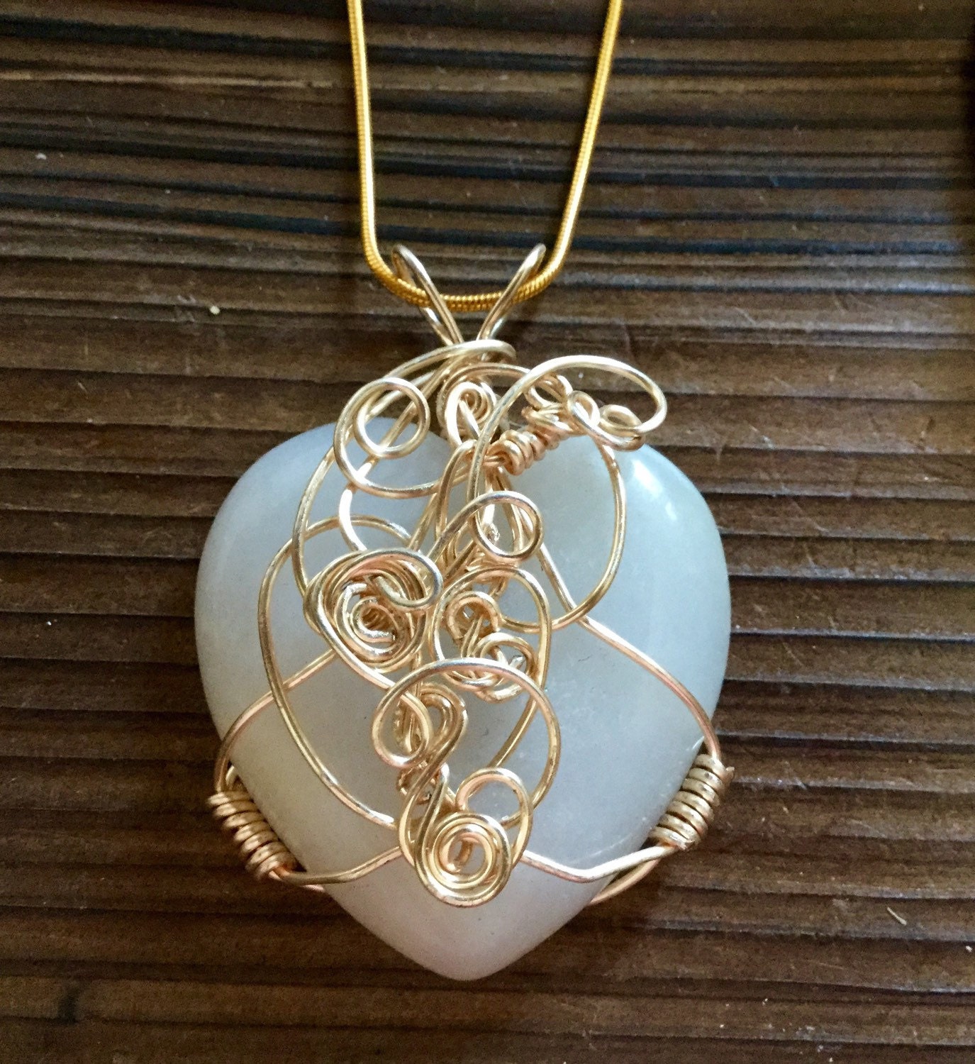 A beautiful wire wrapped heart shaped Quartz pendant necklace.