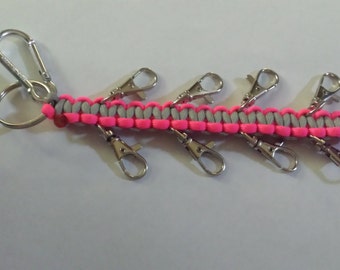 Custome Cheer Bow Holders from Paracord. Comes with 8 clips that hold 16 bows.