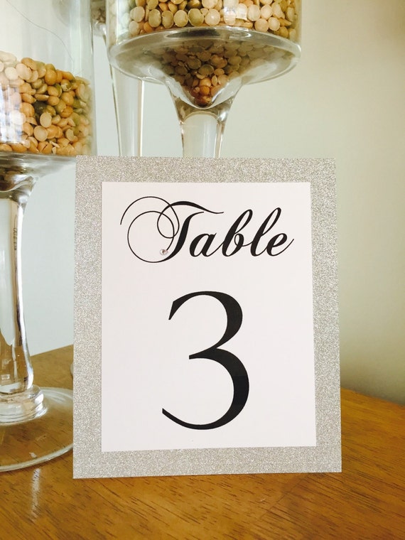 Silver glitter reception table number by DesignsToInvite on Etsy
