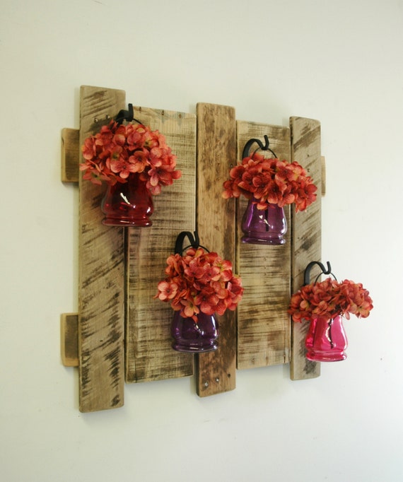Pallet wall decor with colored hanging by PineknobsAndCrickets