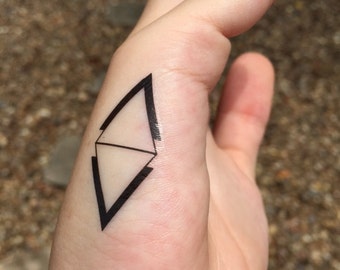 geometric minimalist tattoo design triangle