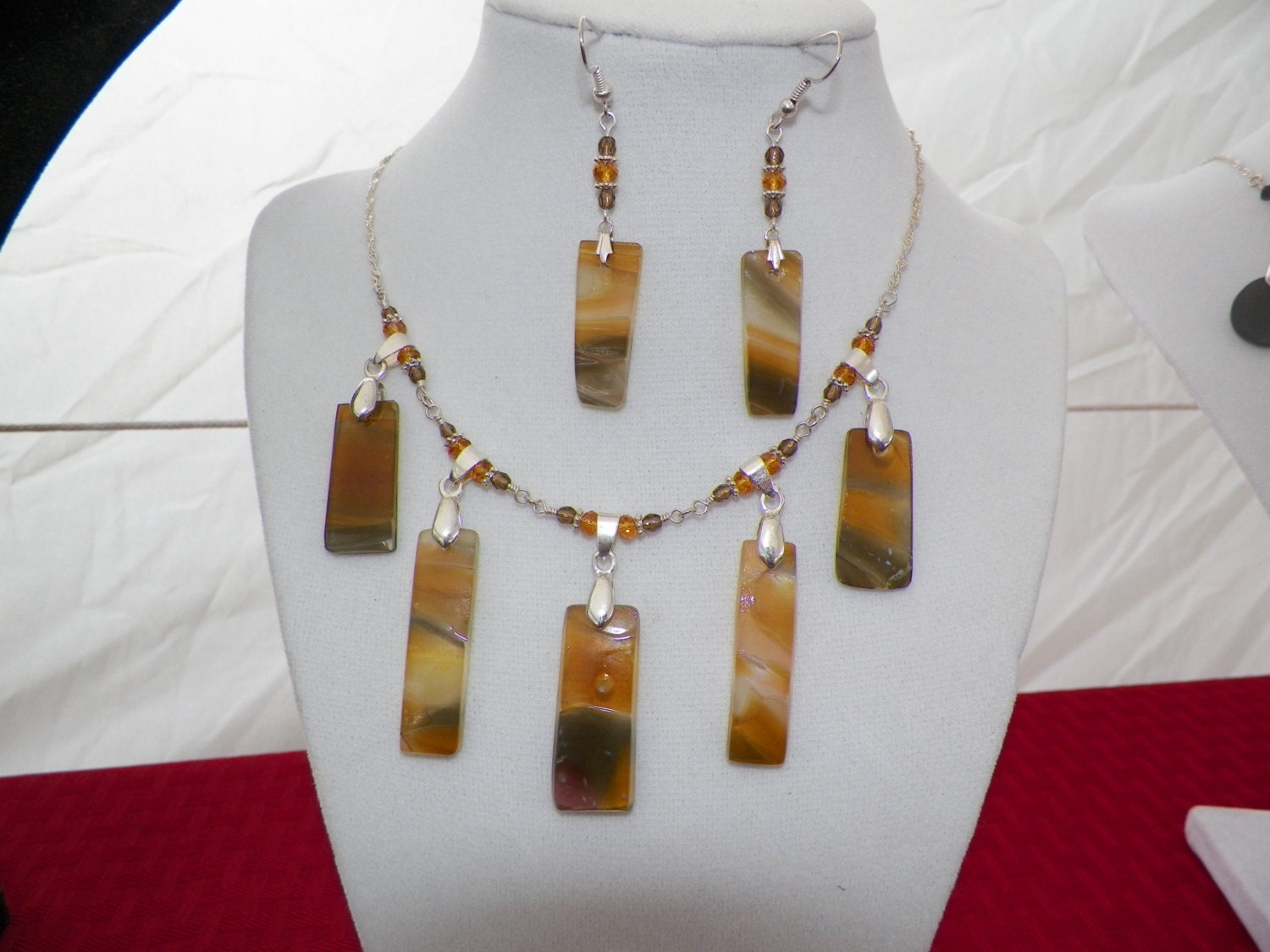 Hand cut glass jewelry in rich amber