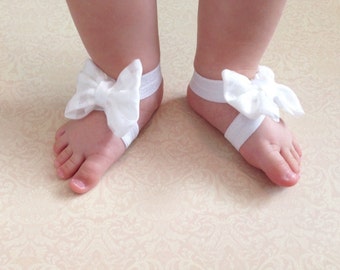 White bow barefoot sandals; baby barefoot sandals; checkered white fabric bows on white elastic barefoot sandals; baby, toddler, girl