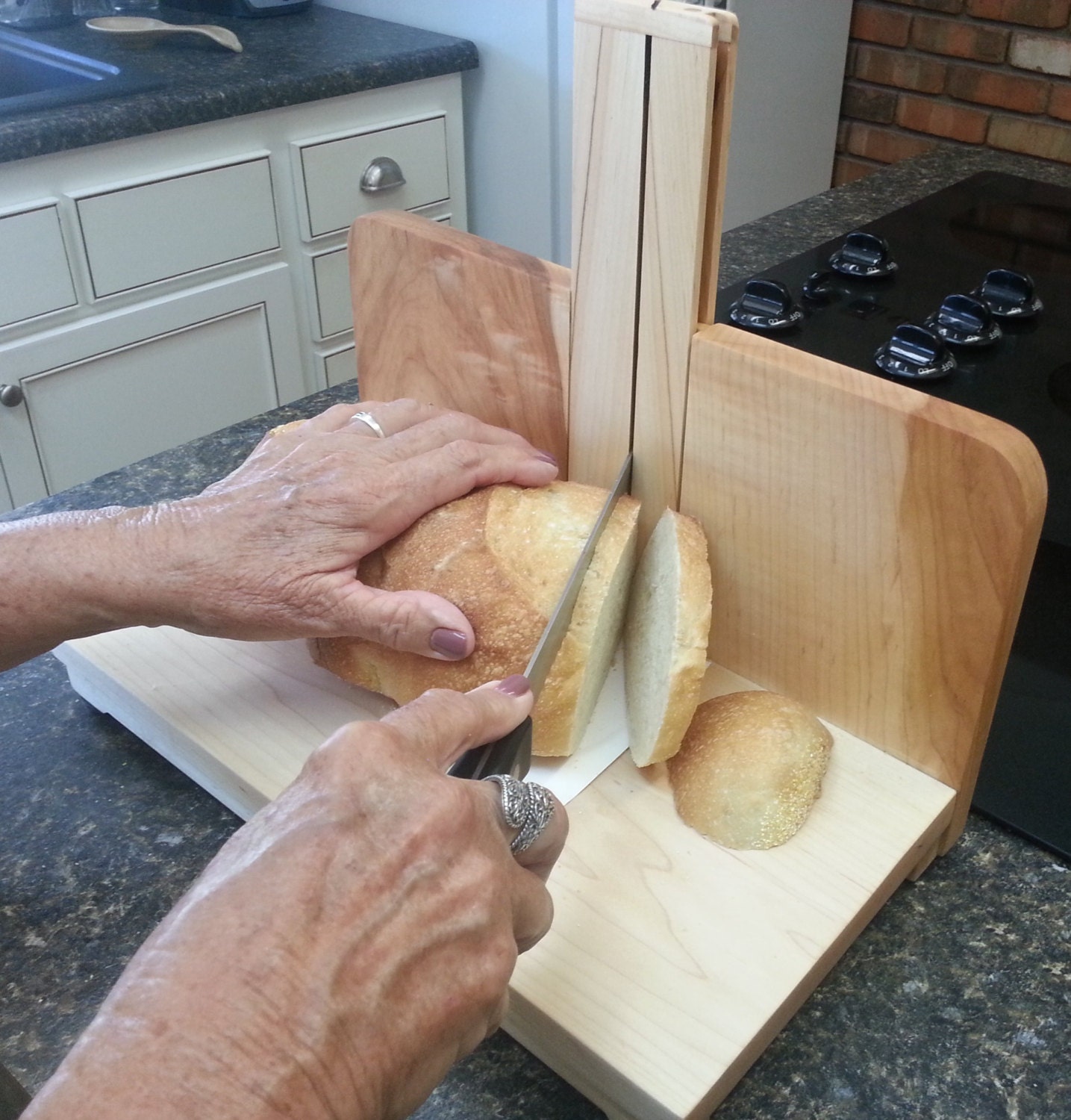 Bread slicer cutting board wood fixture guides knife to cut