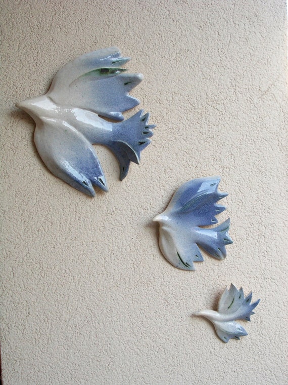 Three doves . Hanging on the wall sculpture.Wall by DeepSilence