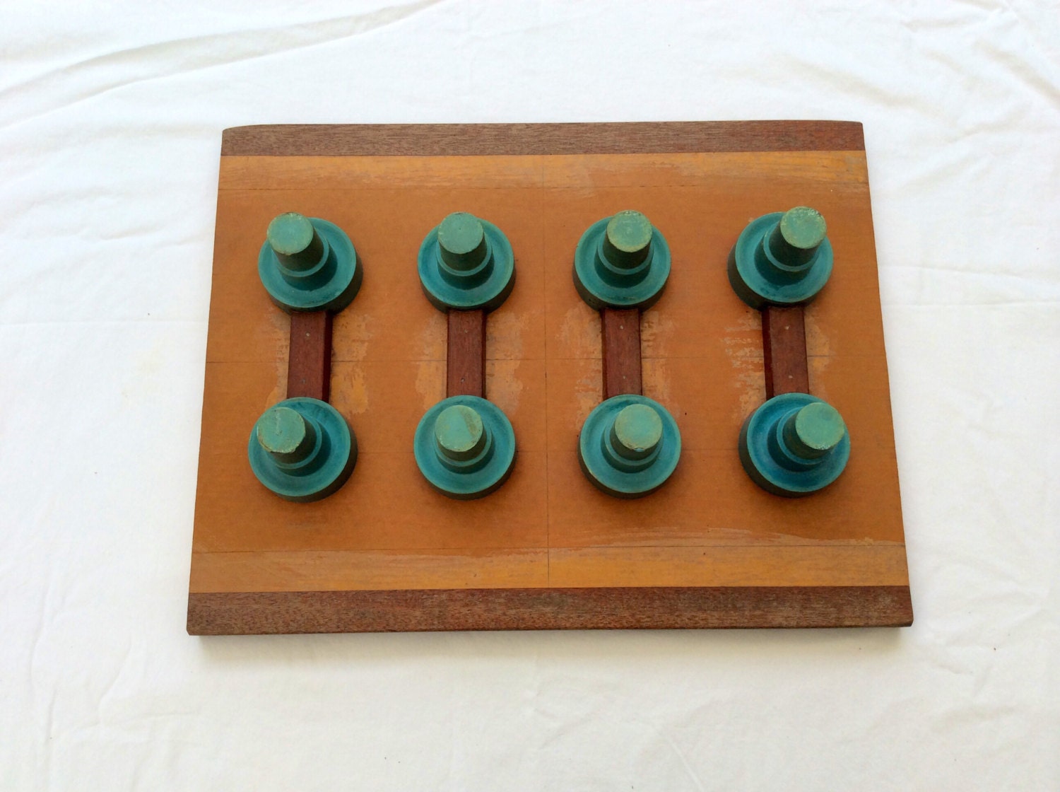 Antique Wood Foundry Mold with brigh turquoise knobs