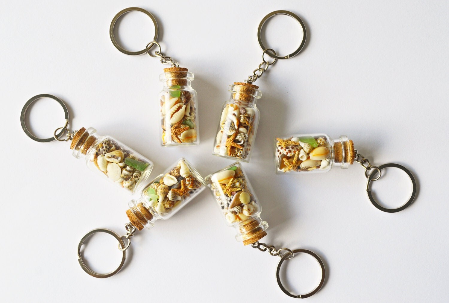 Small Glass Bottle Key chain filled with tiny seashell sea