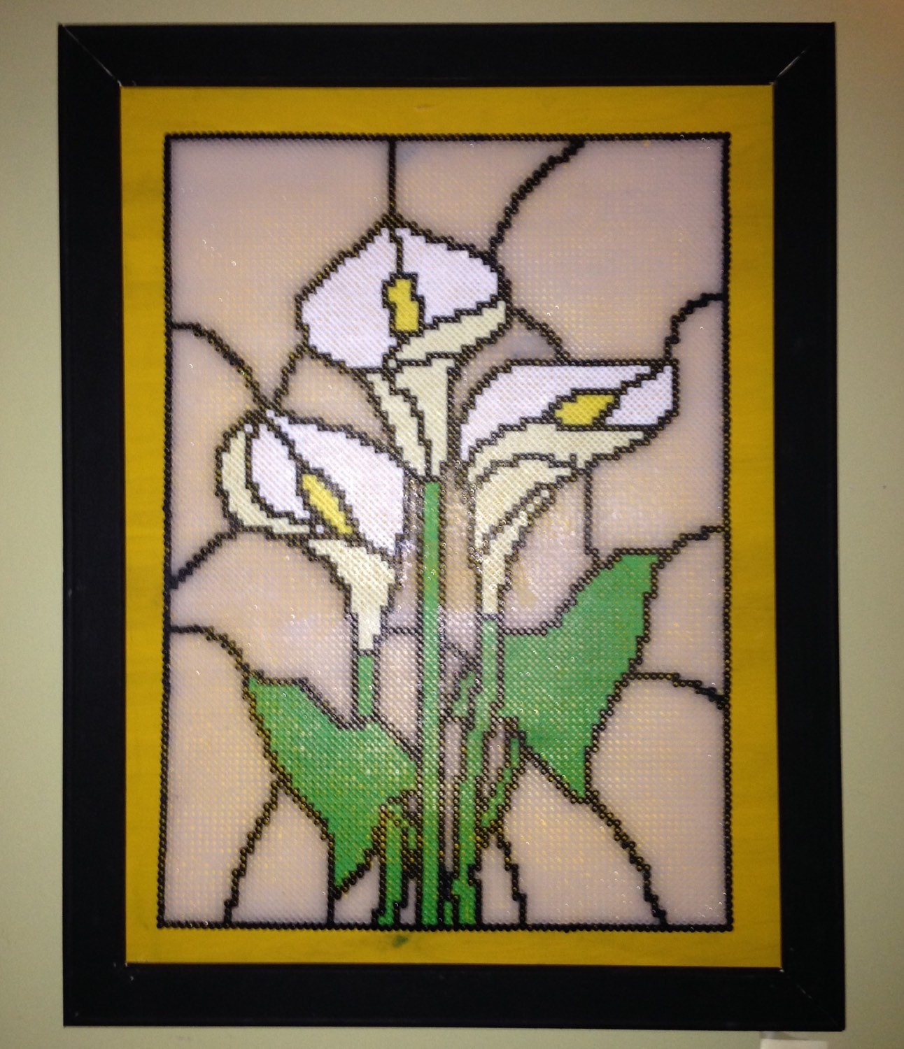 Large stained glass inspired Perler bead art framed.