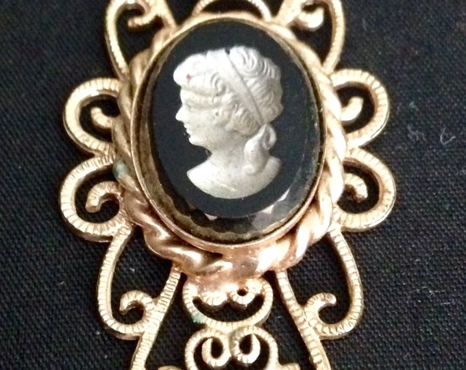 Storewide 25% Off SALE Vintage Gold Tone Adora Signed Designer Cameo Pendant Featuring Unique Black Portrait And Detailed Lattice Trim