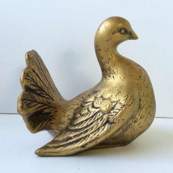 yellow ceramic bird figurine