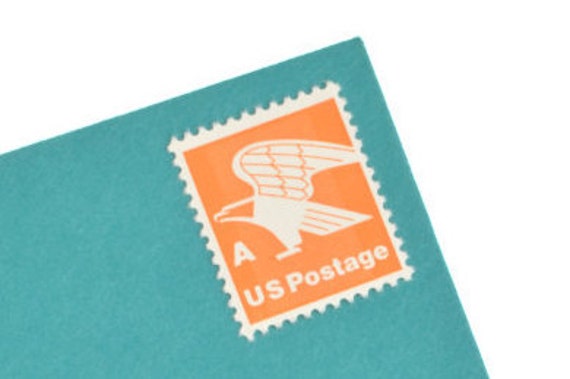 a us postage system stamp orange eagle