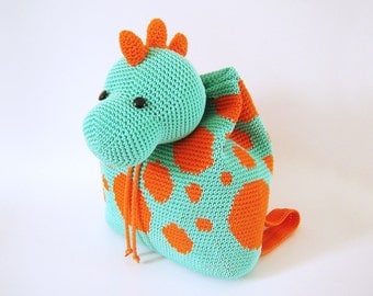 Crochet pattern for dino backpack. Cute and practical accessory for kids. Charts with symbols, written instructions, photo tutorial.