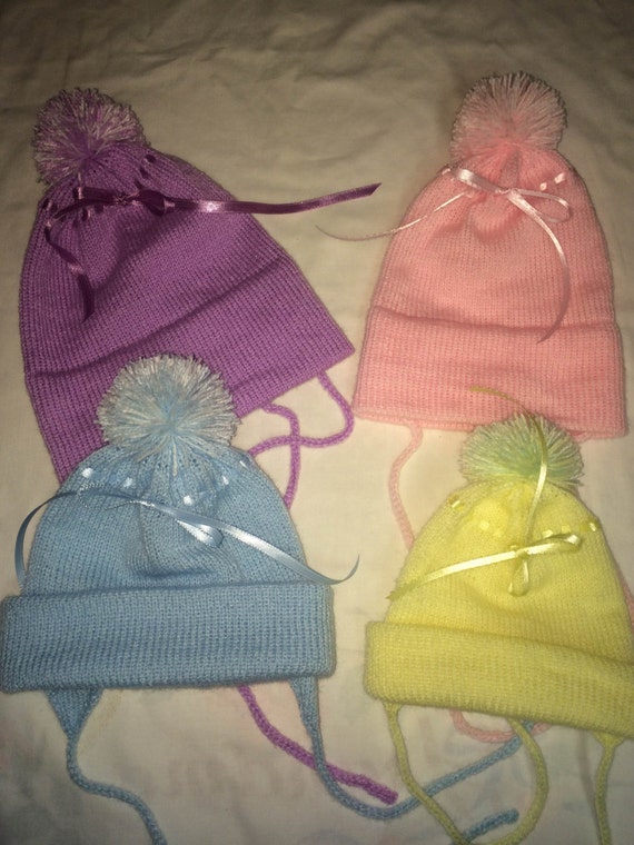 Knitted baby hat with ear flaps. Made to order